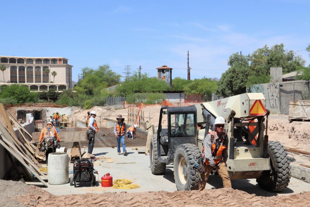 Construction professionals work on the Downtown Links roadway project to connect Barraza-Aviation Parkway with Interstate-10 frontage road.