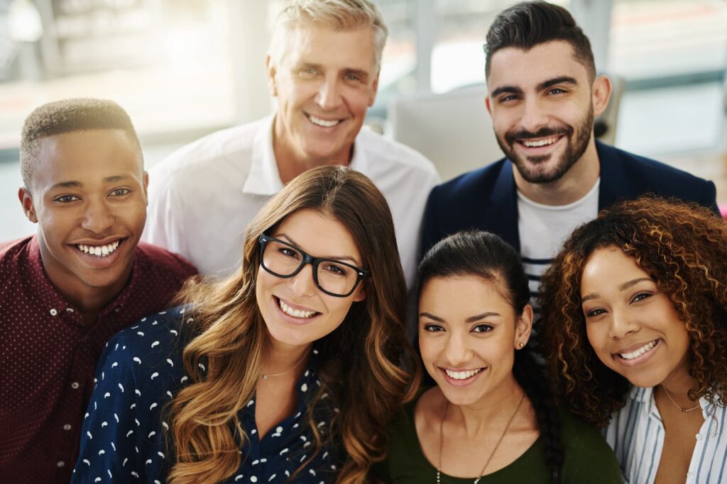 Portrait of a group of confident business people standing together in an office
