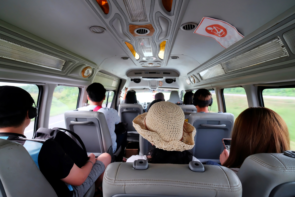 Workers carpool together in a van.