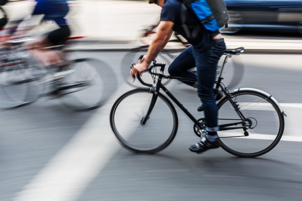 Commuters ride their bikes to work.