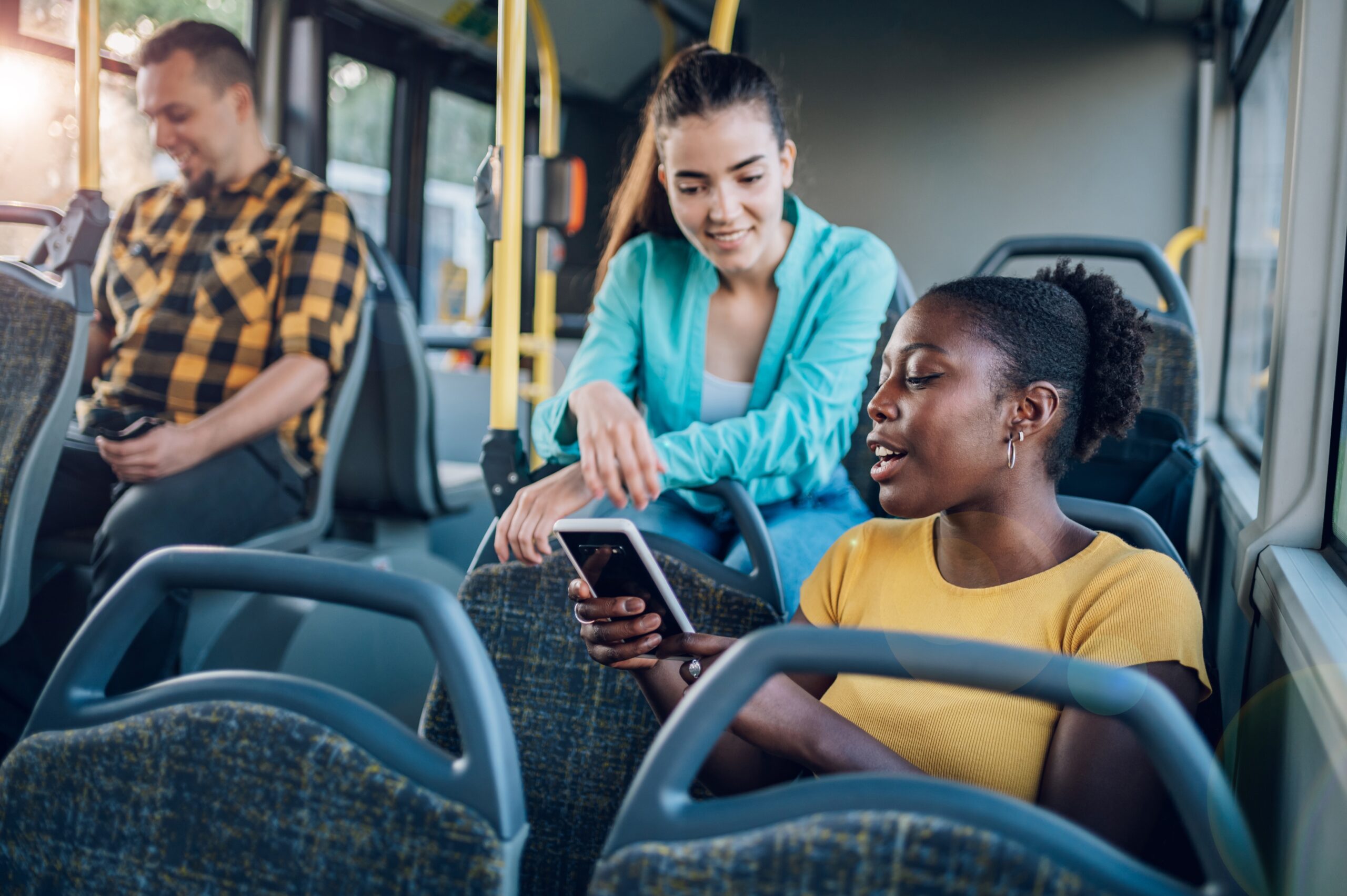 Happy people on a bus.