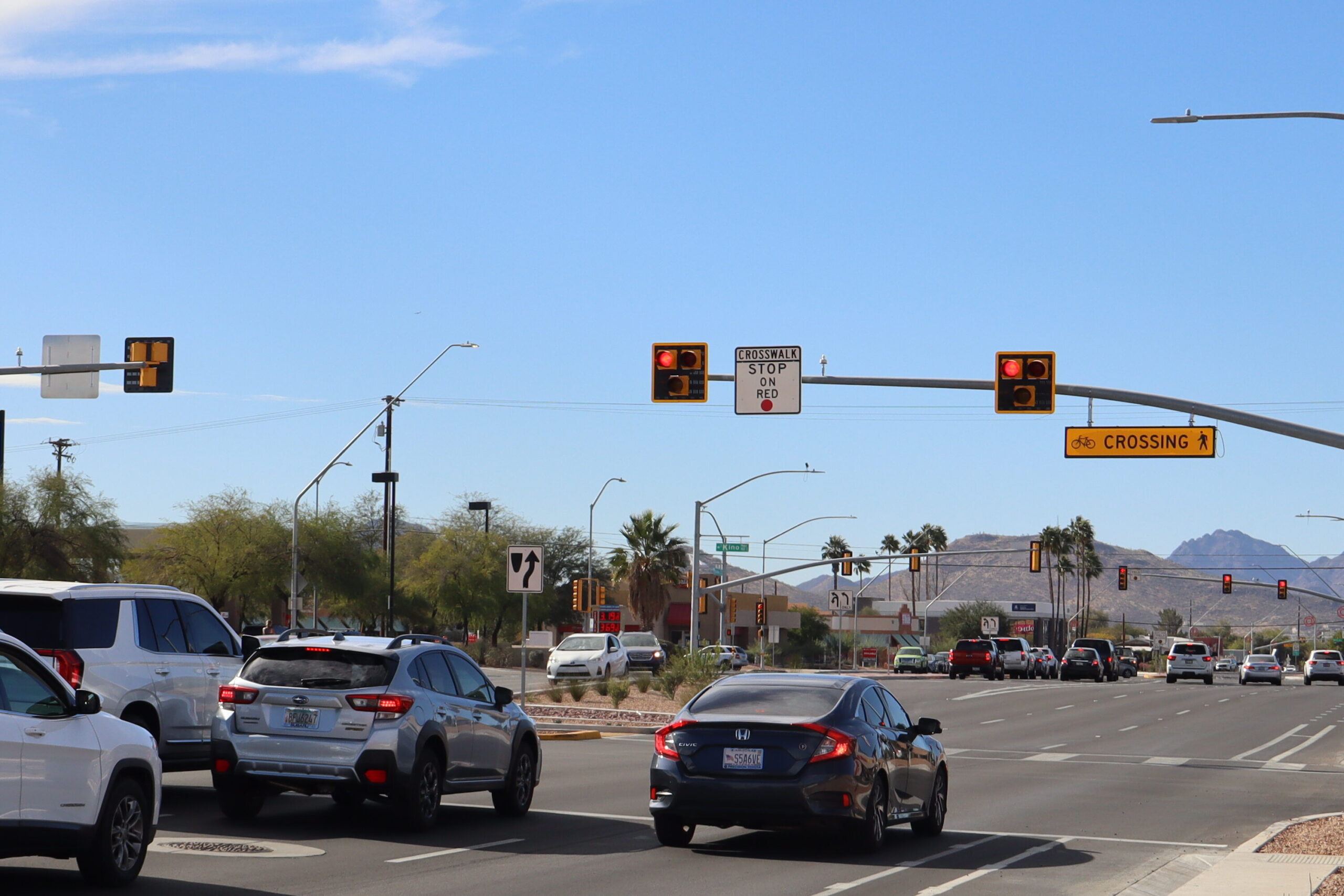 Cars stop at a crosswalk signal in Tucson. 